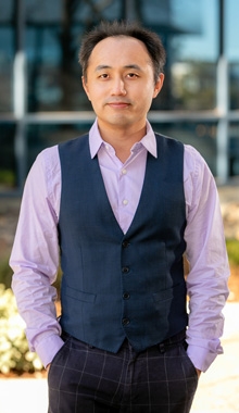 Headshot of John Mei